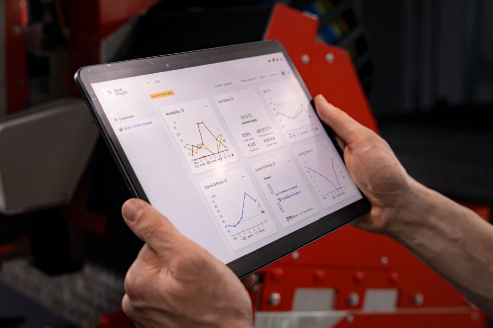 Viewing BySoft Insight software on a tablet held by two hands