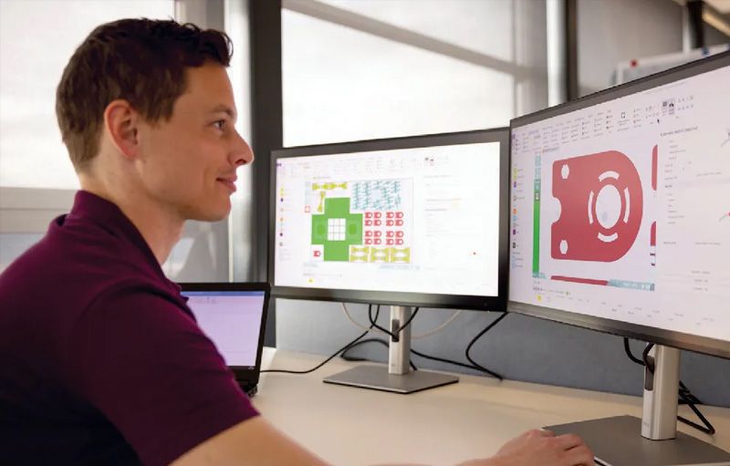 Man reviewing BySoft Suite on desktop monitor