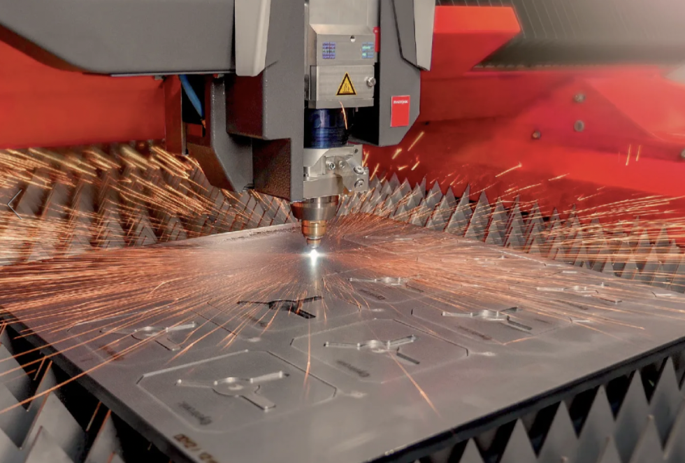 ByCut laser cutting head on flat piece of metal